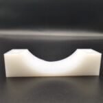 Custom machined UHMWPE U-shape cradle support block