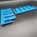 Custom CNC machined blue UHMWPE lane divider indexing comb
