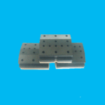CNC machined perforated sliding wear board and guide plate